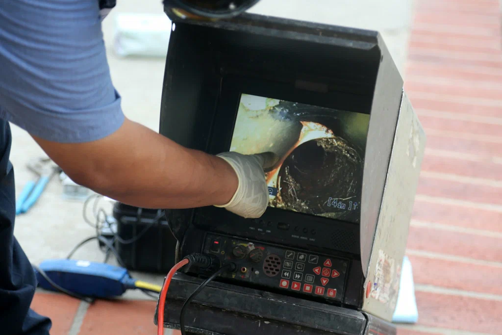 Technician viewing a drain inspection camera in Harrisburg